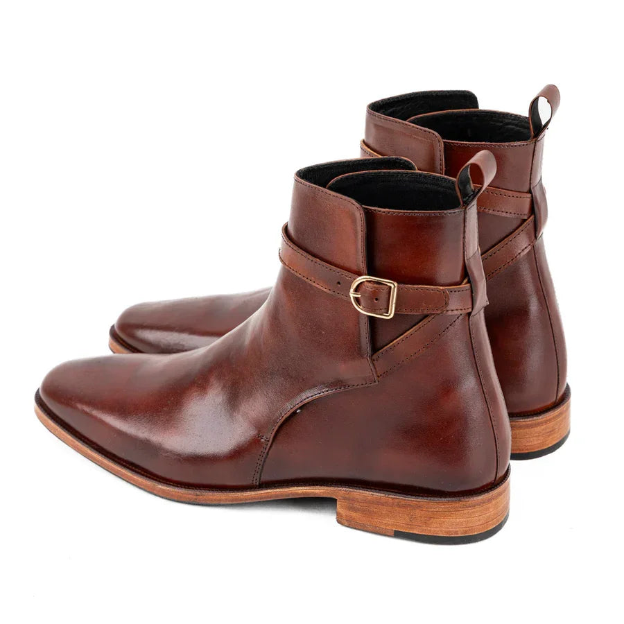 Brown vegan Chelsea boots with ankle strap and buckle, polished finish, wooden sole