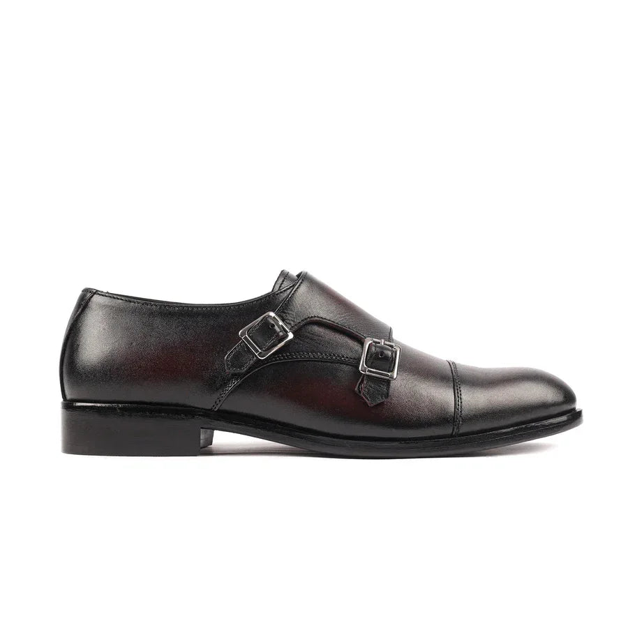 Men's black double monk strap leather dress shoe with silver buckles, side view